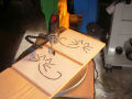 Cutting out the cat sigil with the scroll saw