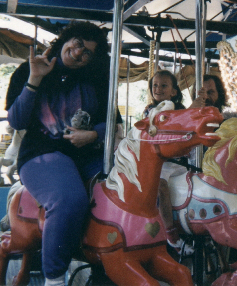 Mou waving while on carousel